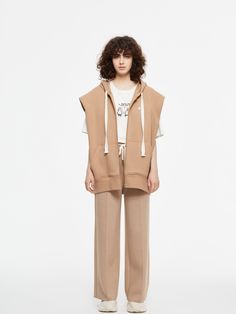 Details: Cotton blended hooded vest in camel Zipfly front closure Pockets on front Logo print on chest Oversized fit Pair with Relaxed Camel Lounge Pants Materials & Care: 74.2% Polyester, 20.2% Cotton, 5.6% Spandex Hand wash | Dry clean Do not bleach Size & Fit: Model is 5'7", Bust 32, Waist 24, Hips 35, wearing a size S Item #: IL3VE03 Wide Leg Lounge Pants, Quilt Jacket, Hooded Vest, Wool Peacoat, Trendy Clothes, Lounge Pants, Blazer Coat, Wool Coat, Uniqlo