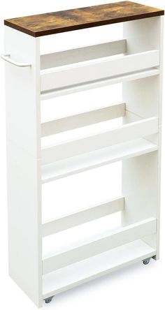 a white kitchen cart with wood top and wheels on the bottom, against a white background