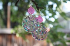 Beautiful handmade resin earrings. With pink & blue sparkles & bright neon pink accents these are definitely a show stopper. They also work with blacklight so be sure to take them on your next bowling trip. Pink Resin Earrings For Party, Funky Pink Earrings For Gift, Funky Pink Jewelry For Party, Funky Handmade Pink Earrings, Pink Plastic Earrings For Party, Funky Pink Handmade Earrings, Pink Glitter Resin Jewelry, Pink Plastic Party Earrings, Pink Hypoallergenic Plastic Earrings