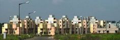 an old building with many windows and balconies on the top of it's sides