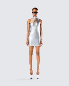 It’s not about looking pretty, it's about looking otherworldly 😏 Made from metallic silver-coated stretch jersey and complete with custom logo hardware trim, a mock neck, and a bodycon fit for a look that will have everyone trying to reach your level ✨ Modern Fitted Bodycon Party Dress, Glamorous Fitted High Neck Bodycon Dress, Metallic Bodycon Dress For Club, Silver Sleeveless Bodycon Dress, Sleeveless Silver Bodycon Dress, Shiny Club Bodycon Dress, Silver Fitted Mini Bodycon Dress, Glamorous Silver Fitted Bodycon Dress, Silver Sleeveless Fitted Bodycon Dress