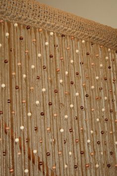 the curtain is made up with beads on it