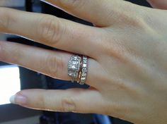 two women's hands with wedding rings on their fingers