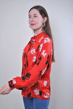 "Flowers print women retro red long sleeve blouse, Size XL Welcome to TARASCOMMON.ETSY.COM Unique clothing from the 20th century. Model tall - 170cm XL. Sleeve - 40cm / 15.74inch; ( armpit to end of sleeve); Width - 60cm / 23.62inch; Length - 65cm / 25.59inch. All measurements are taken seam to seam while lying flat. This item is vintage, so it can have some defects. Additional photos can be send We are glad that you are interested in lots that we sell. Wish you a good shopping! FOLLOW US : Inst Red Graphic Print Blouse For Fall, Casual Long Sleeve Vintage Fashion Tops, Casual Long Sleeve Tops For Vintage Fashion, Long Sleeve Tops For Vintage Fashion, Spring Vintage Long Sleeve Tops, Vintage Long Sleeve Blouse For Fall, Vintage Long Sleeve Tops For Spring, Long Sleeve Blouse For Fall Vintage Fashion, Long Sleeve Blouse For Vintage Fashion In Fall