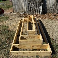 several wooden boxes sitting in the grass