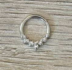 "This clicker piercing is made of high quality surgical steel with beautiful CZ clear crystals. Works for septum clicker, daith earring, rook jewelry, tragus ring, or cartilage hoop. Piercing \"clicks\" into place. Super dainty minimalist look - drop jaws with this body jewelry! **PACKAGE INSURANCE: Please either upgrade to priority express shipping at checkout if you would like to insure your package OR you can also purchase insurance separately Insurance up to $100 for $1.50 here: https://www. Surgical Steel Septum Ring, Crystal Septum Ring, Silver Daith Jewelry, Septum Piercing Jewelry Dainty, Septum Piercing Jewelry Silver, Daith Piercing Jewelry Silver, Pretty Septum Piercing, Septum Piercing Cute, Septum Piercing Silver