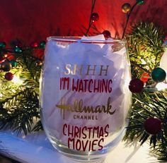 a wine glass with the words sheh i'm watching hallmark christmas movies on it