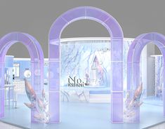 an image of a show room set up with purple arches and glass walls for display