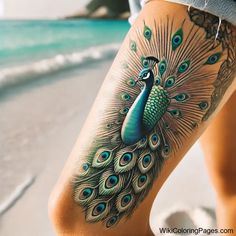 a peacock tattoo on the leg of a woman