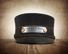 a black hat with the words conductor on it