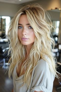 Woman with tousled blonde hair and blue eyes in a salon setting. Choppy Long Layers Haircut, Long Layered Messy Hair, Long Layered Textured Haircut, Beach Babe Hair, Fall Blonde Long Hair, Long Blonde Haircut Ideas, Choppy Long Haircut, 2024 Long Hair Cuts For Women, Long Rachel Haircut