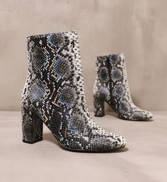 pair of black textured upper on the slither over here bootie Snake Room, Statement Boots, Unique Boots, Unique Fall, Toes Designs, Almond Shaped, Python Print, Heels Boots, Shoe Fits