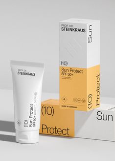 the sun protect sunscreen is next to two boxes