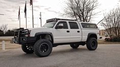 a large white truck parked in a parking lot