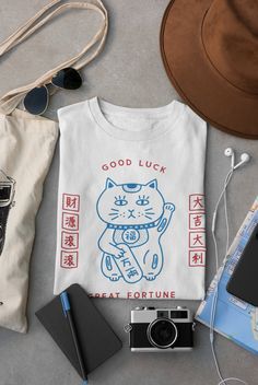 Fortune Series Fortune Cat Unisex T-Shirt Lucky Cat | Etsy Fortune Cat, Japanese Shirt, Diy Shirts, Neko Cat, Japanese Cat, Baby Fits, Japanese Streetwear, Life Expectancy, Club Shirts