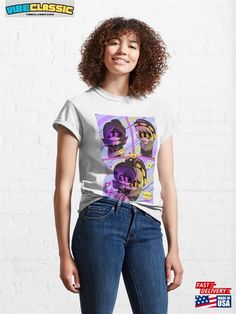 a woman wearing a white t - shirt with an image of three people on it