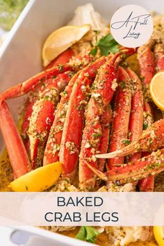 baked crab legs with lemon wedges and parsley on top in a white dish