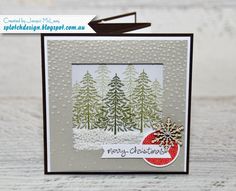 a handmade christmas card with trees and snowflakes on the front, which reads merry christmas