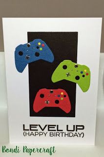 a card with three video game controllers on it, and the words level up happy birthday