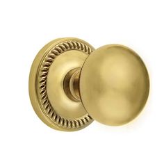 an antique brass door knob on a white background