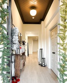 the hallway is decorated with christmas decorations and lights