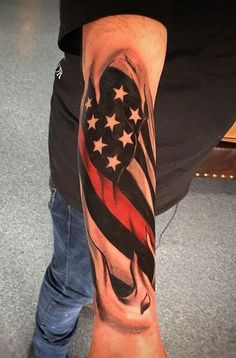 a man's arm with an american flag tattoo on the side of his leg