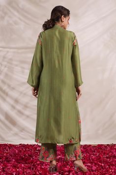 Green silk kurta with front gathered panel, multi color placement floral print, sequin, bead and French knot thread embroidered highlights. Paired with palazzo with printed border.
Components: 2
Pattern: Printed and Hand Embroidered
Type Of Work: Floral Print, Bead, Sequin and French Knot Thread Work
Neckline: V Neck
Sleeve Type: Full Sleeves
Fabric: Silk
Color: Green
Other Details: 
Embroidered yoke
Side slits
Embroidered highlights
Model height: 5ft inches, wearing size S
Note: Kindly contact Silk Straight Kurta With Printed Motifs, Festive Silk Kurta With Printed Motifs, Designer Silk Kurta With Printed Motifs, Unstitched Silk Kurta With Printed Motifs, Silk Kurta With Printed Motifs For Diwali, Festive Raw Silk Kurta With Printed Motifs, Spring Chanderi Salwar Kameez With Mirror Work, Festive Raw Silk Sets With Printed Motifs, Green Chanderi Palazzo Set With Floral Embroidery