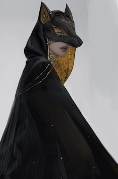 a woman wearing a black cat mask with gold chains on her head and an elaborate collar