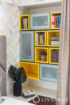 a bedroom with yellow shelving and bookshelves on the wall next to a bed