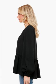 Flowy and flattering, the Carlota Peplum Blouse is a wardrobe must-have. This top features puff sleeves with elastic wrists, keyhole button back closure, high-low silhouette, and a peplum hem detail. Pair with denim and a change of accessories for a look that will take you from desk to drinks! Crew neckline Cuffed sleeves Slightly puffed sleeves High-low Peplum detail Material: 100% Polyester Care: Hand wash cold Long Sleeve Peplum Top, Chain Scarf, Tennis Tops, Scarf Poncho, Fancy Party, Peplum Blouse, Peplum Hem, Monogram Styles, Puffed Sleeves