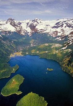 an aerial view of the mountains and lakes