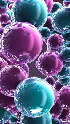 many bubbles are floating in the air with purple and blue colors on them, as well as