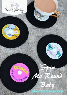 four coasters with the words spin me round baby next to a cup of coffee