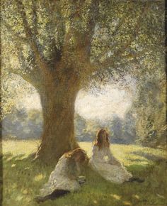 two women sitting under a large tree in the shade, one is leaning on her head