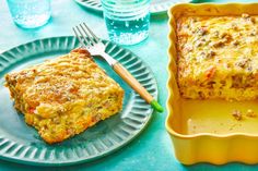 a casserole on a plate with a fork next to it and water glasses