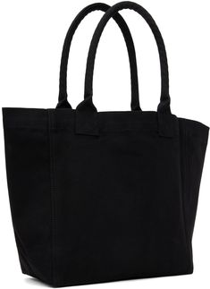 Nylon canvas tote in black. · Rolled shoulder straps · Logo flocked at face · Open throat · H12.5 x W19.5 x D4.75 Supplier color: Black Black Rectangular Canvas Bag With Canvas Lining, Black Shopping Bag With Canvas Lining, Black Canvas Bag For Errands, Black Tote Shoulder Bag With Canvas Lining, Black Canvas Bag With Canvas Lining For Shopping, Black Canvas Bag For Shopping With Canvas Lining, Black Double Handle Bag With Canvas Lining, Black Cotton Canvas Bag With Reinforced Handles, Modern Black Canvas Bag For Errands