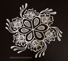 an intricately designed flower design on a black background