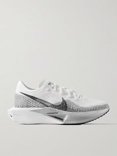 Nike Running defines its 'ZoomX Vaporfly 3' sneakers as "the original super shoe". ; This pair is made from lightweight Flyknit ; Bouncy 'ZoomX' soles provide an energy-returning response ; Widened midsoles help evenly distribute weight for a more stable stride Nike Vaporfly, Low Top Nikes, Womens Workout Shoes, White Shoes Sneakers, Gym Inspo, Luxury Sneakers, Workout Shoes, Sneakers For Men, Classic Sneakers