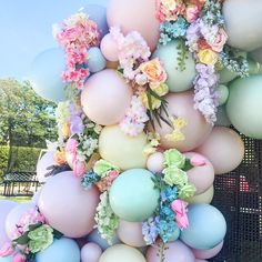 a bunch of balloons that have flowers on them