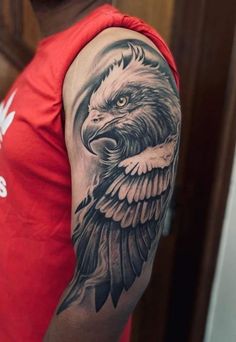 a man with a bald eagle tattoo on his arm