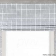 a window with a gray and white checkered roman blind