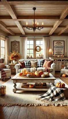 a living room filled with furniture and lots of pumpkins on the coffee table in front of it