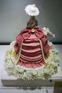 there is a cake made to look like a woman's dress