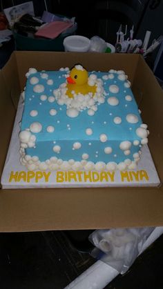 a birthday cake in the shape of a rubber ducky