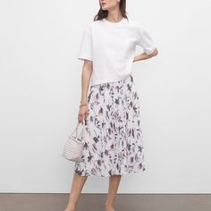 Florals Dress Up This Crinkled Wear-Everywhere Midi Skirt, While A Relaxed A-Line Silhouette. Elasticated Waistband 30" From Top Of Skirt 29" Waist Super Soft Elastic For Comfort Casual Spring Voluminous Pleated Skirt, Casual Summer Tiered Pleated Skirt, White Pleated Hem Skirt For Day Out, Casual Tiered Skirt With Pleated Waist, Casual Voluminous Pleated Skirt For Summer, Floral Print Tiered Pleated Skirt For Summer, White Flowy Tiered Pleated Skirt, Summer Daywear Pleated Tiered Skirt, Summer Daywear Tiered Pleated Skirt