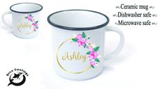 two white coffee mugs with pink flowers and the name eshley on them