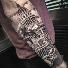 a man's arm with an old car and the capitol building tattooed on it