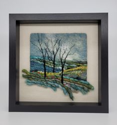 a painting with trees in the middle and water on it's side, framed