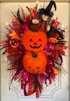 Wreath in orange, white, and pink mesh. Accented with various coordinating ribbon, pumpkins and the cutest witch!  These CANNOT be put between your storm door and regular door.  While I try my best to ensure I use the highest quality of florals that are best for outdoors, it's best to keep your wreath where it is protected from the elements. In due time some colors will fade and that is just due to the elements taking its effect on the wreath.  This wreath is ready to ship and will be on your do Monster Front Door Decoration, Trick Or Treat Wreath, Circus Halloween Wreath, Monster Decor, Green Monster Wreath, Monster Wreath, Monster Decorations, Pink Halloween Wreaths & Garlands, Storm Door