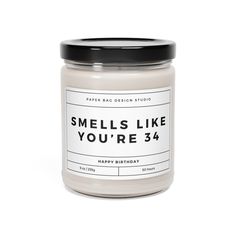 a candle that says smells like you're 34 on the front and back side